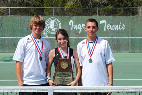 Ashton (left) at the Ingram tennis courts with two teammates, medals around their necks, holding the district champions plaque