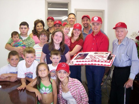 Big multi-generation family gathering with cake