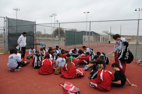 The Ingram tennis courts with the team gathered